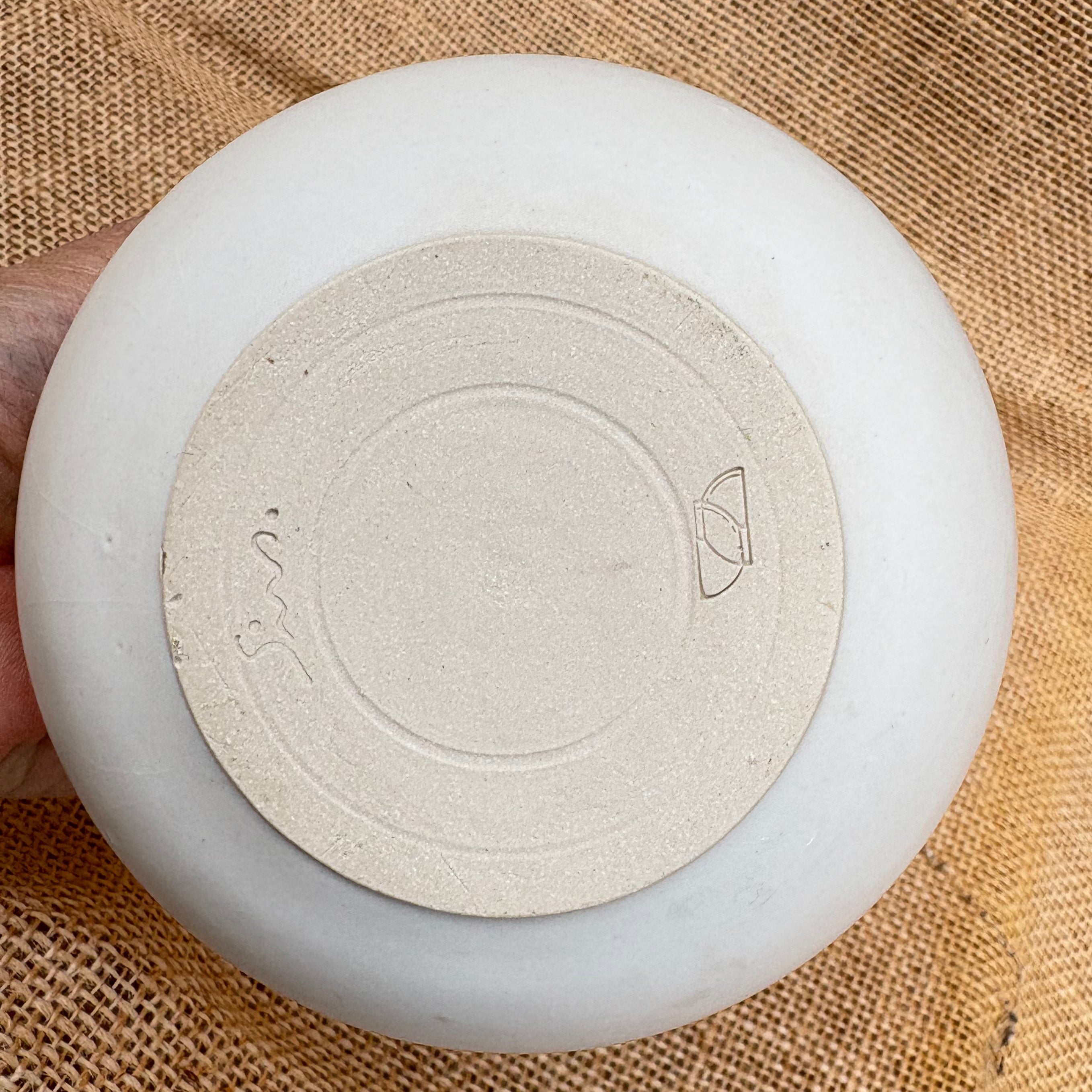 Base of white ceramic tealight holder